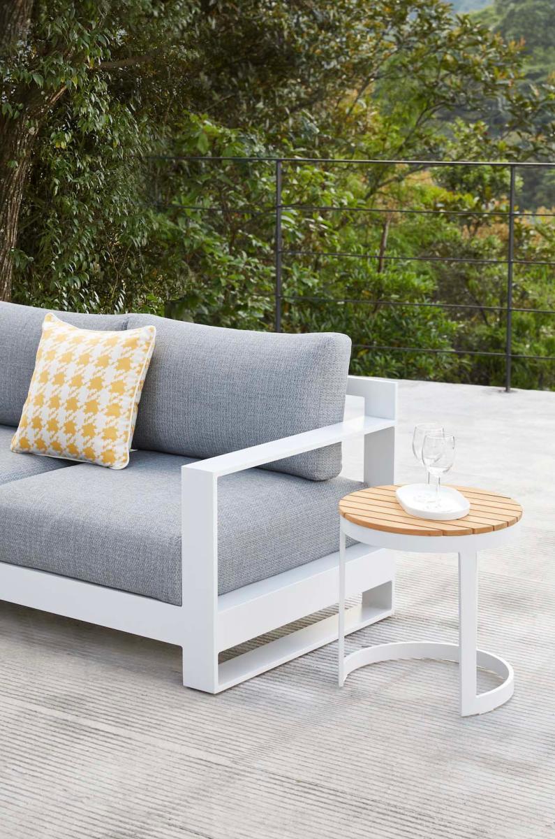 Iris round aluminum and teak outdoor side table – shown outdoors (2)