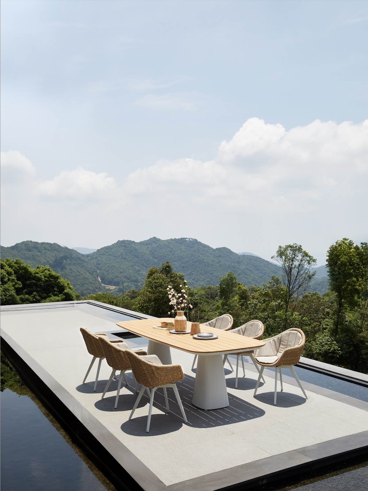 Milo teak-top aluminum outdoor dining table for eight – shown outdoors (3)