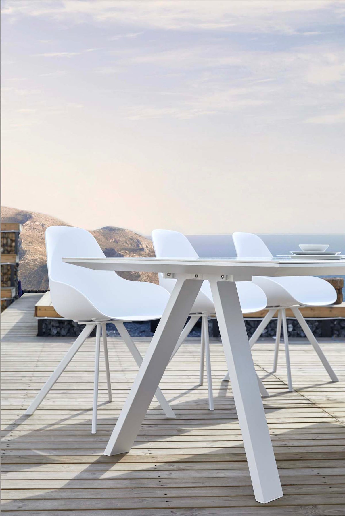 Mondo white ceramic outdoor dining table with X legs, 240 cm – shown outdoors (4)