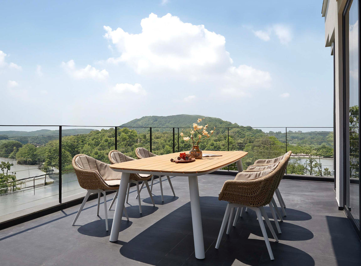 Lara rounded-corner teak and white aluminum outdoor dining table – shown outdoors (3)