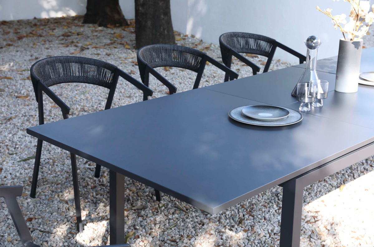 Lou black extendable aluminum outdoor dining table – shown outdoors (4)