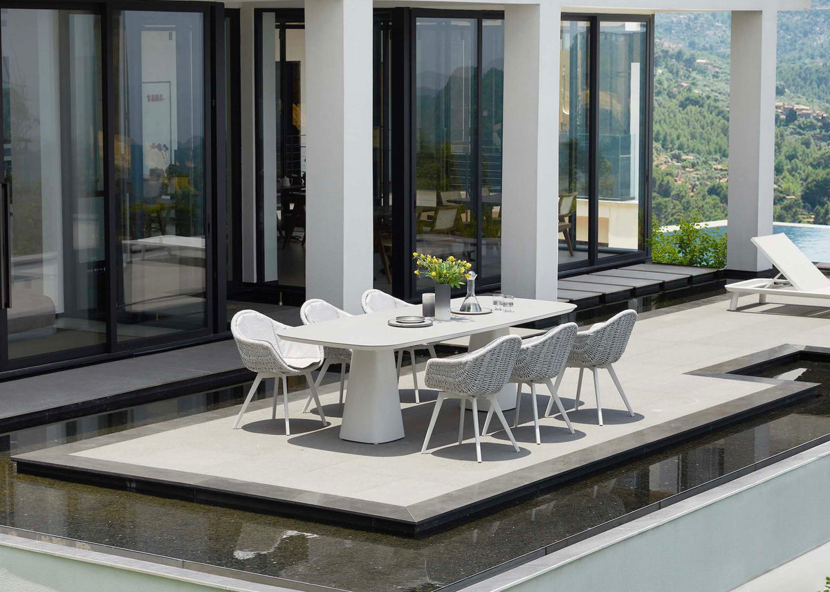 Milo aluminum ceramic-top outdoor dining table for eight – shown outdoors (3)