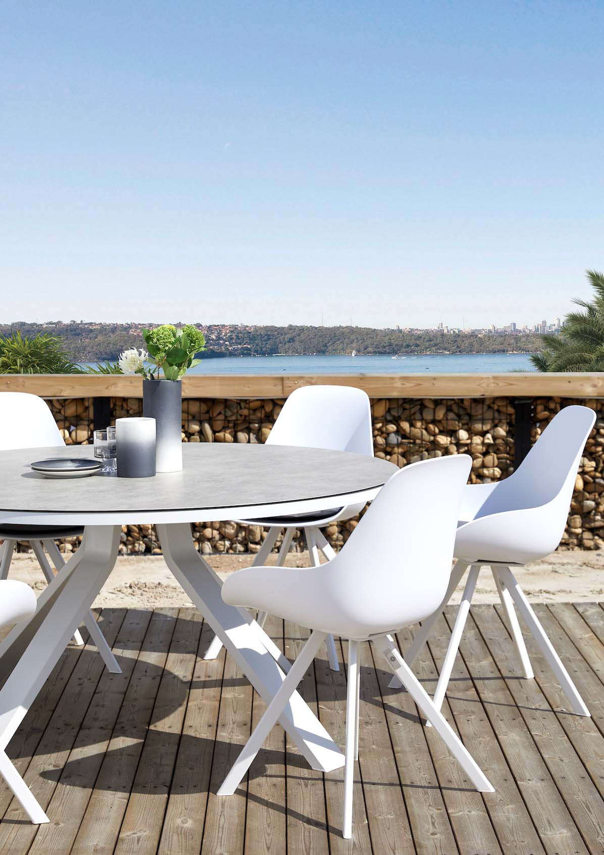 Mondo round white aluminum table with marble-effect glass top – shown outdoors (5)