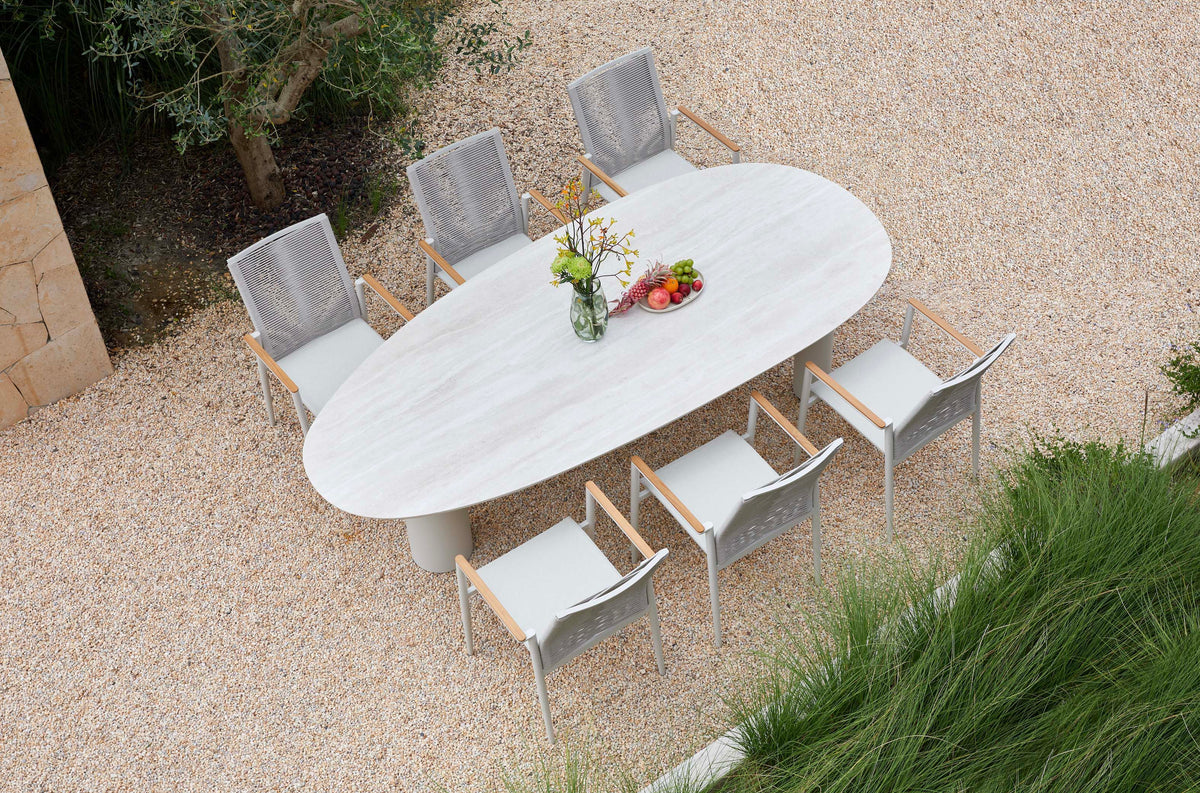 Lyse round ceramic outdoor dining table with three legs – shown outdoors (3)