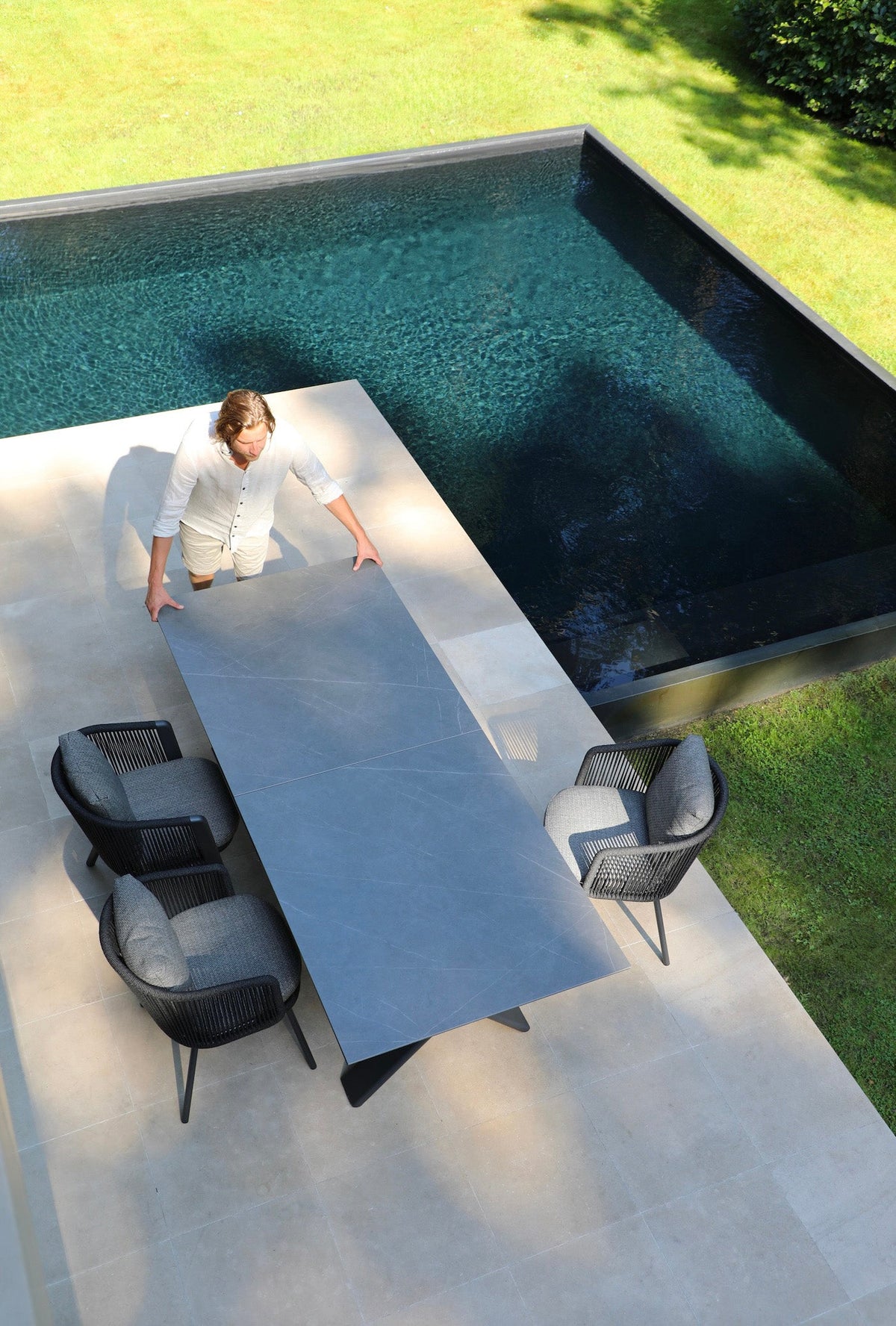 Livio black aluminum and rope outdoor dining armchair – shown outdoors (6)