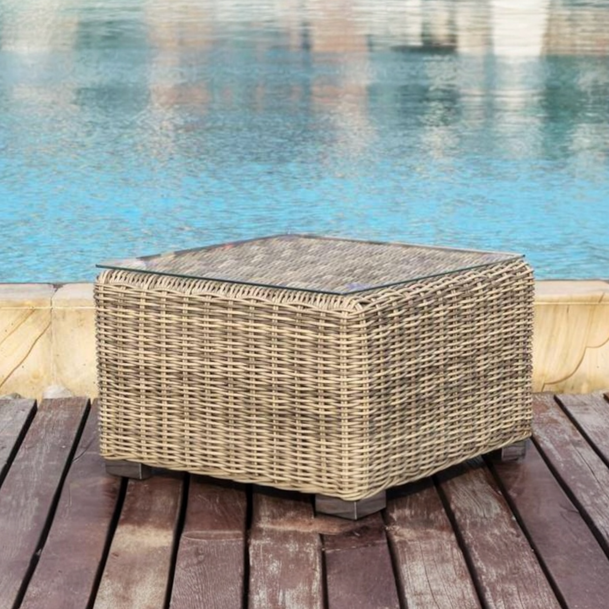 Liberty resin wicker side table with glass top – shown outdoors