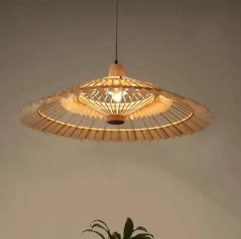 Rattan fan pendant light, shown lit