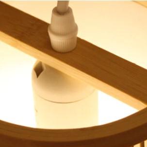 Domed rectangular handmade rattan wall sconce – close-up detail, lit