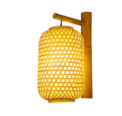 Slender handwoven rattan lantern wall sconce – shown lit