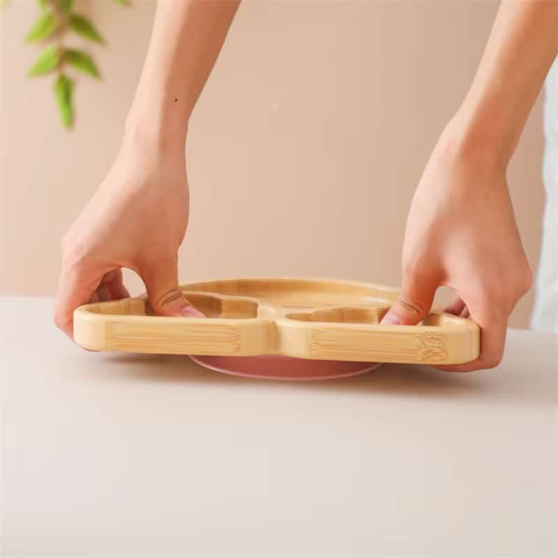 Bamboo baby plate with a silicone suction base – shown in use (2)
