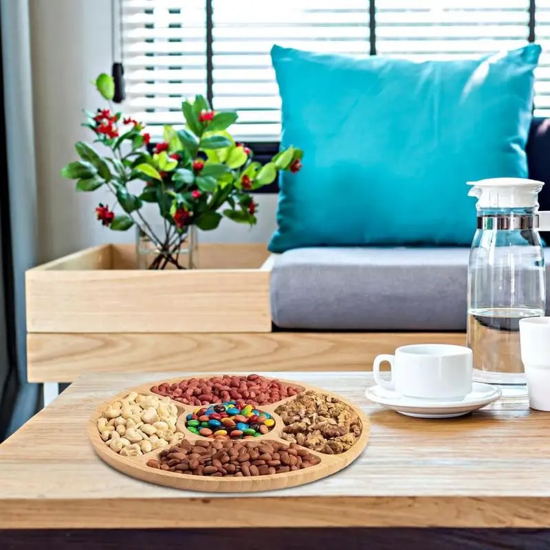 Round handwoven bamboo plate divided into compartments – shown in a room setting (2)