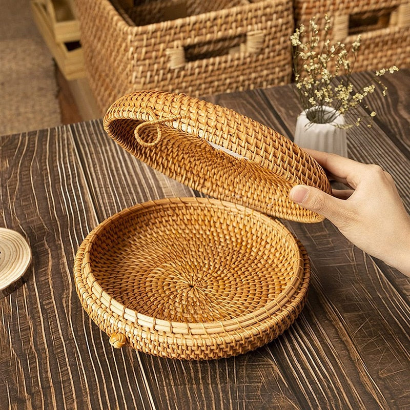 Round woven rattan jewelry box with a geometric pattern and lid – shown in use (2)