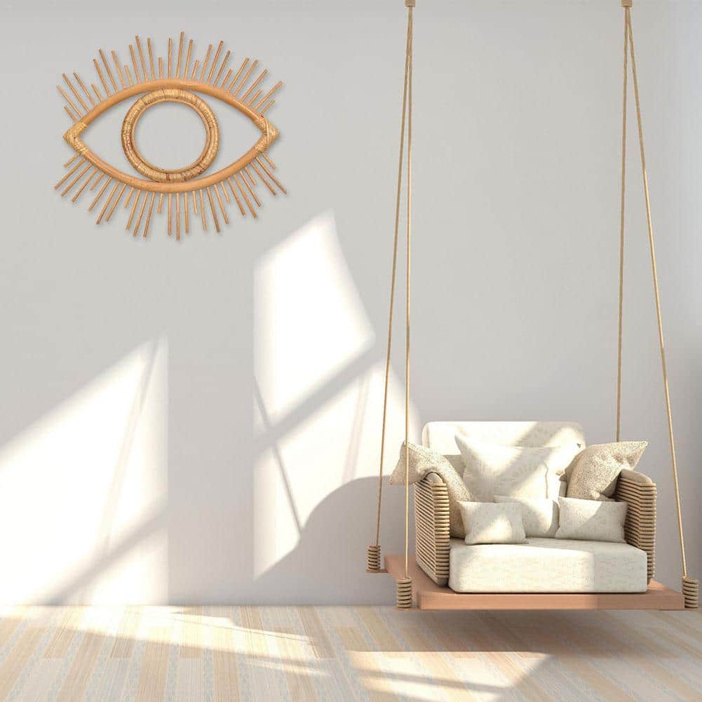 Eye-shaped rattan wall frame with a tight braid – shown in a room setting
