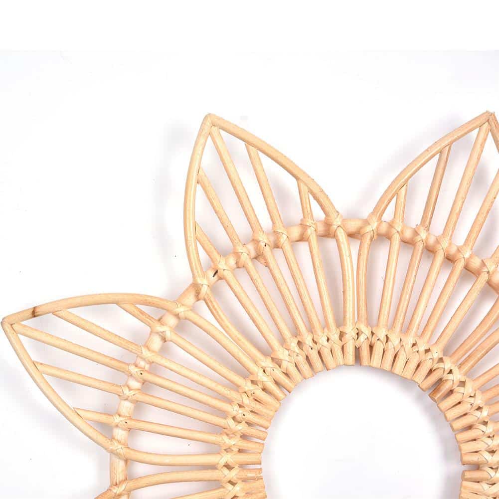 Sun motif rattan frame with hand-braided radiating stems – close-up detail