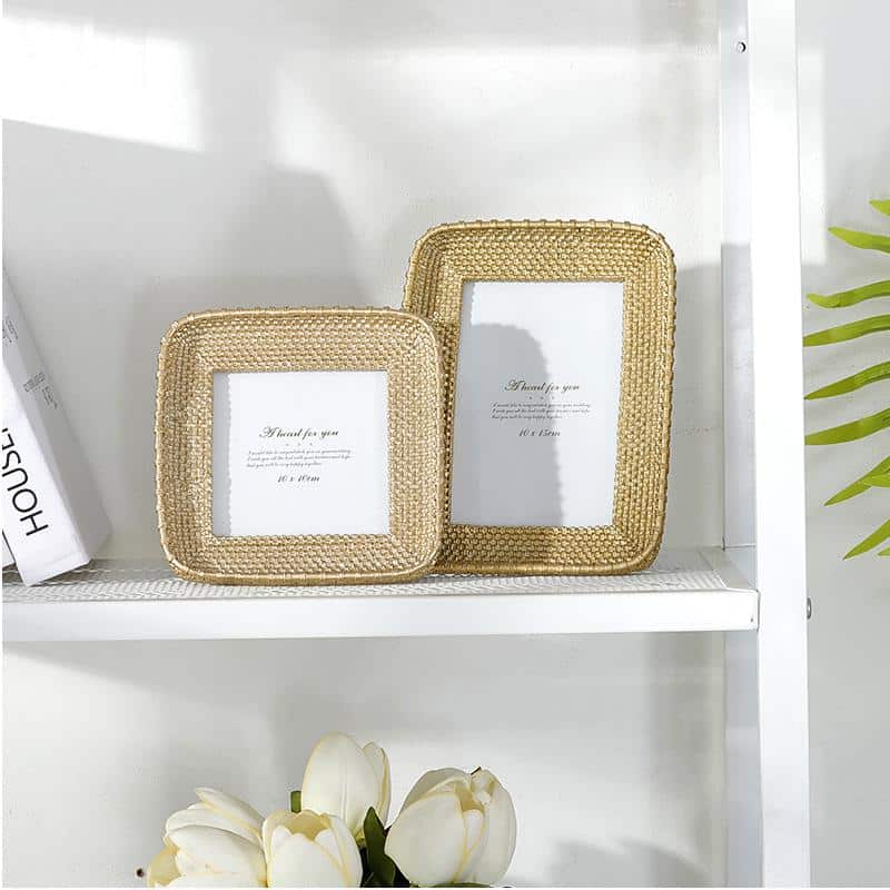 Vintage rectangular resin and rattan photo frame in honey-gold – shown in a room setting