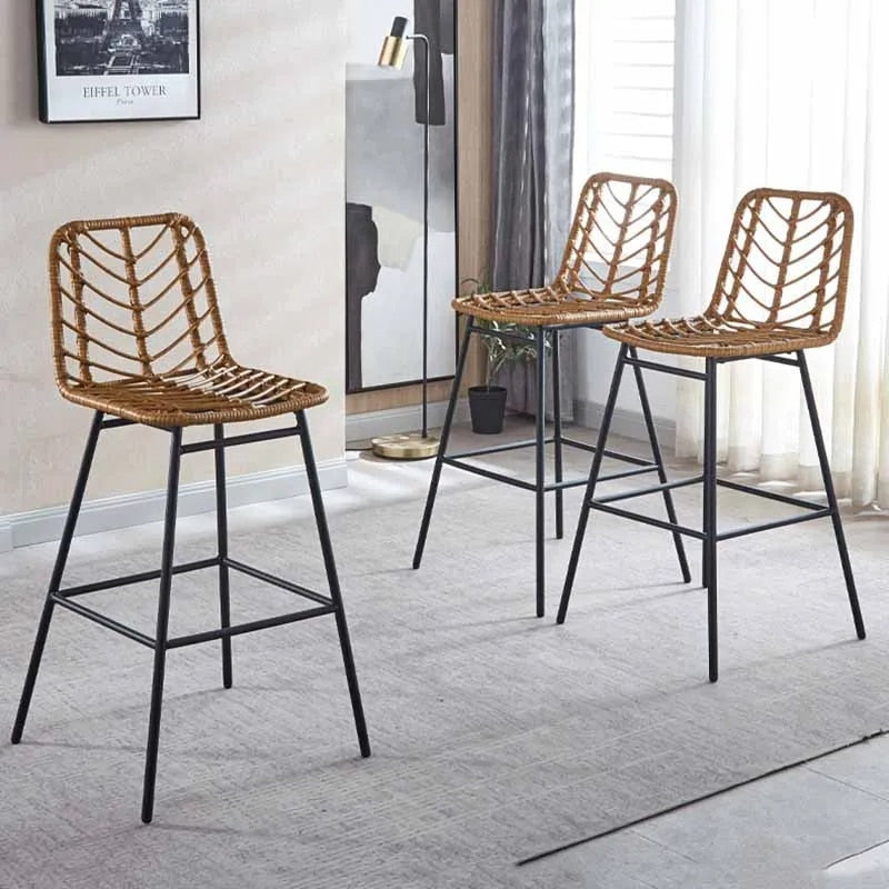 Tall rattan bar chair with a hand-braided backrest – shown in a room setting
