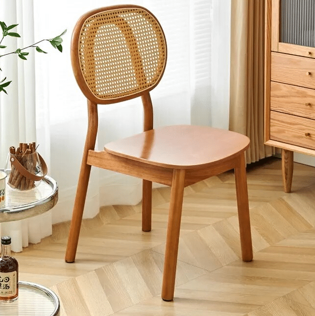 Rattan dining chair with a brown solid wood frame – shown in a room setting