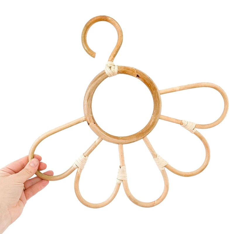 Sunflower rattan kids hanger – shown in use