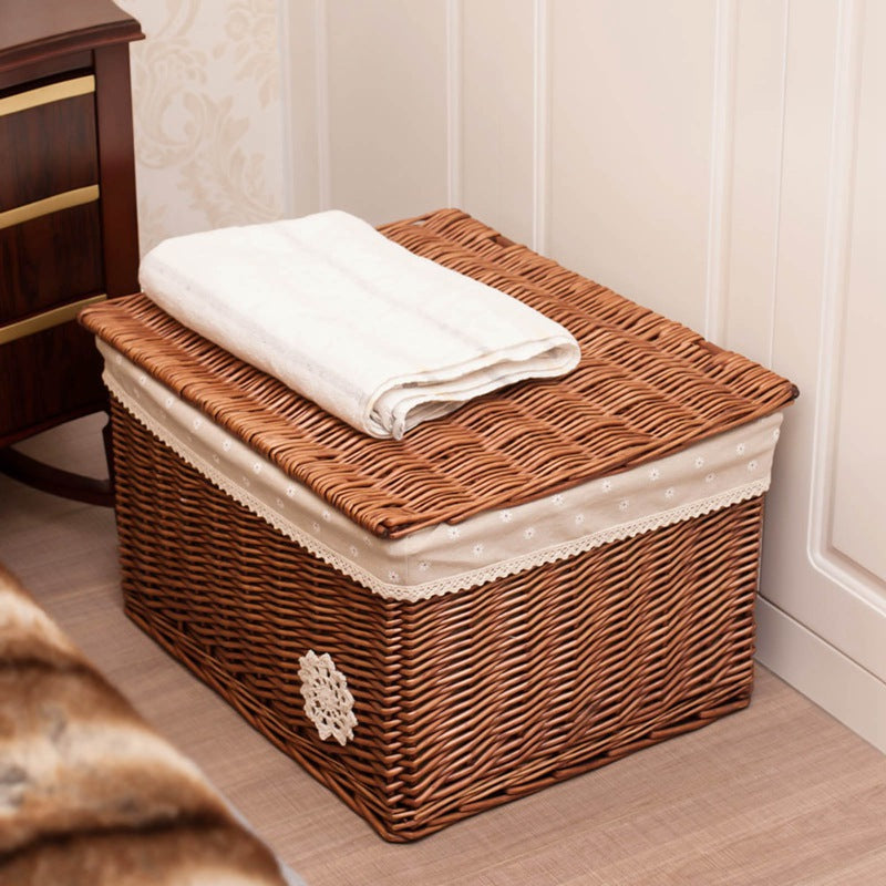 Lined rattan toy basket with lace trim – shown in a room setting (3)