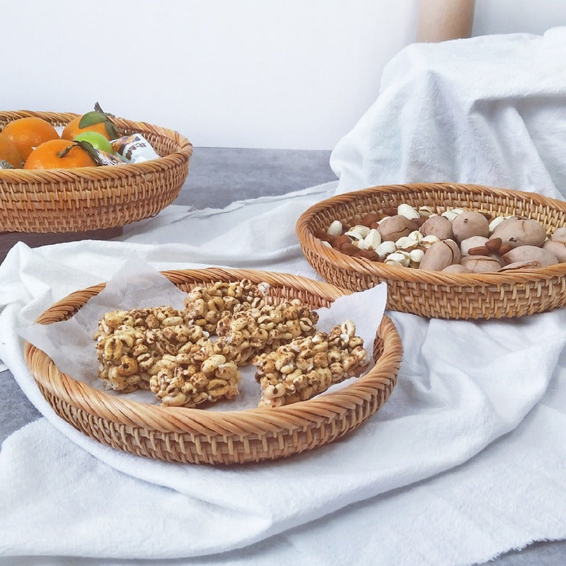 Handmade round rattan basket with a generous shape – shown in a room setting (3)