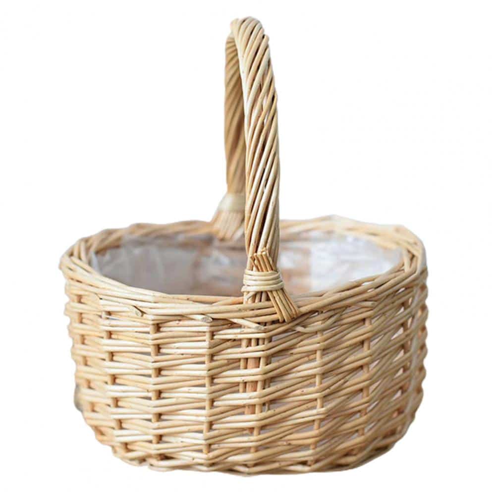 Beige round handwoven rattan basket with a sturdy handle – close-up detail
