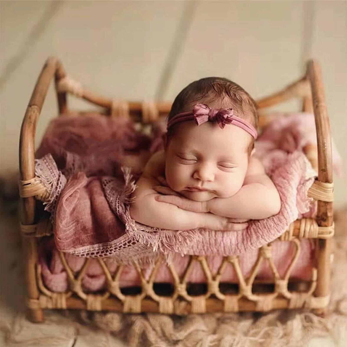 Openwork handwoven rattan moses basket – shown in use