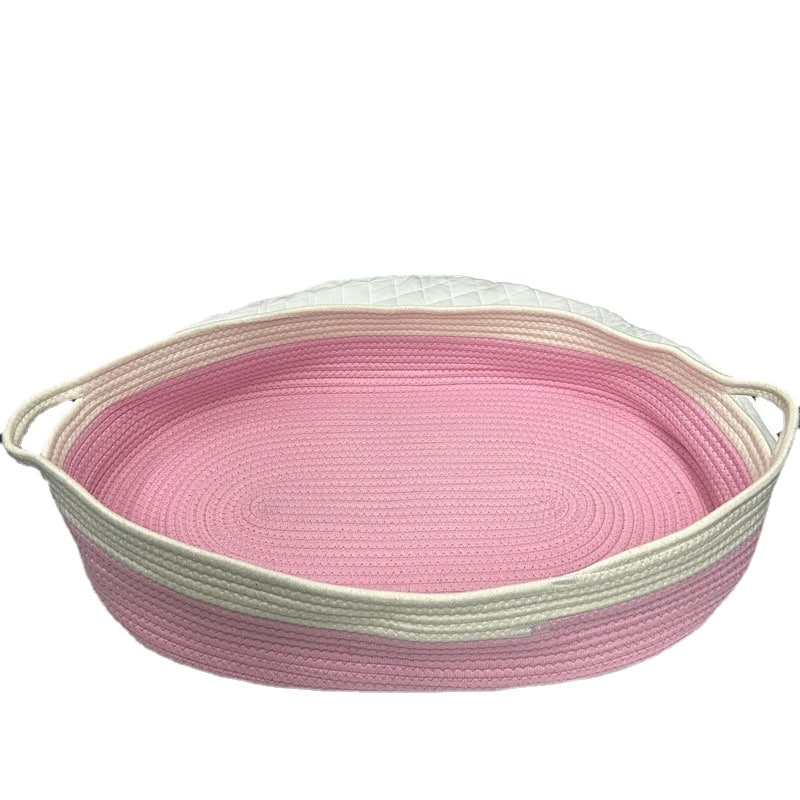 Pink and white synthetic rattan moses basket