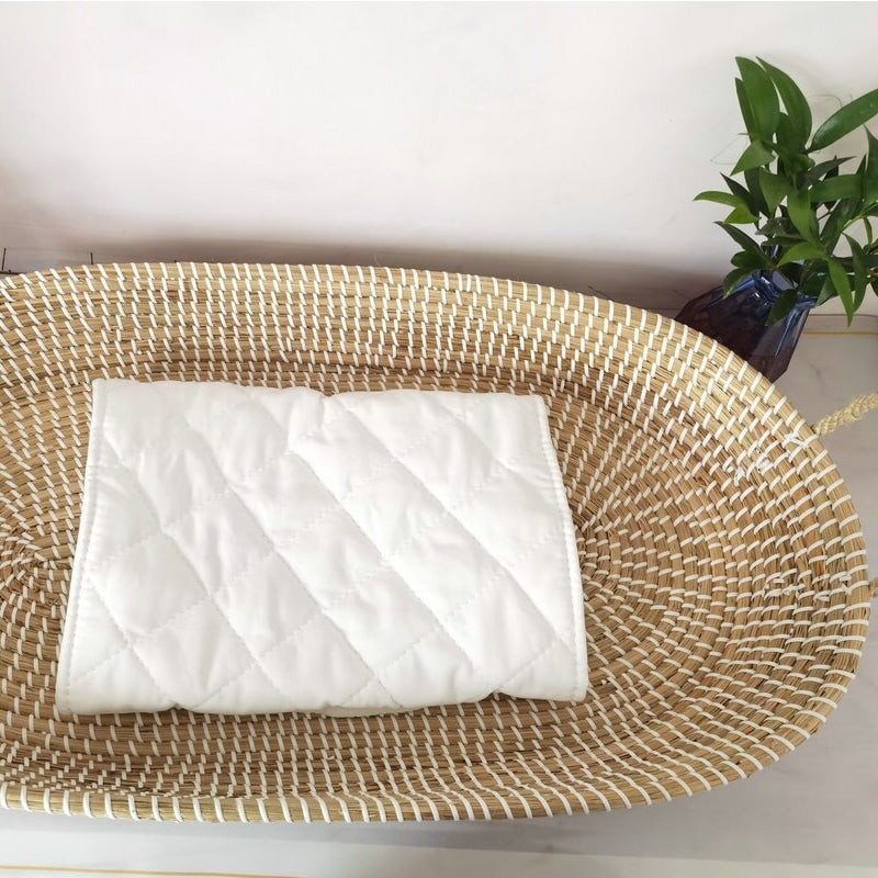 Braided rattan moses basket with integrated handles