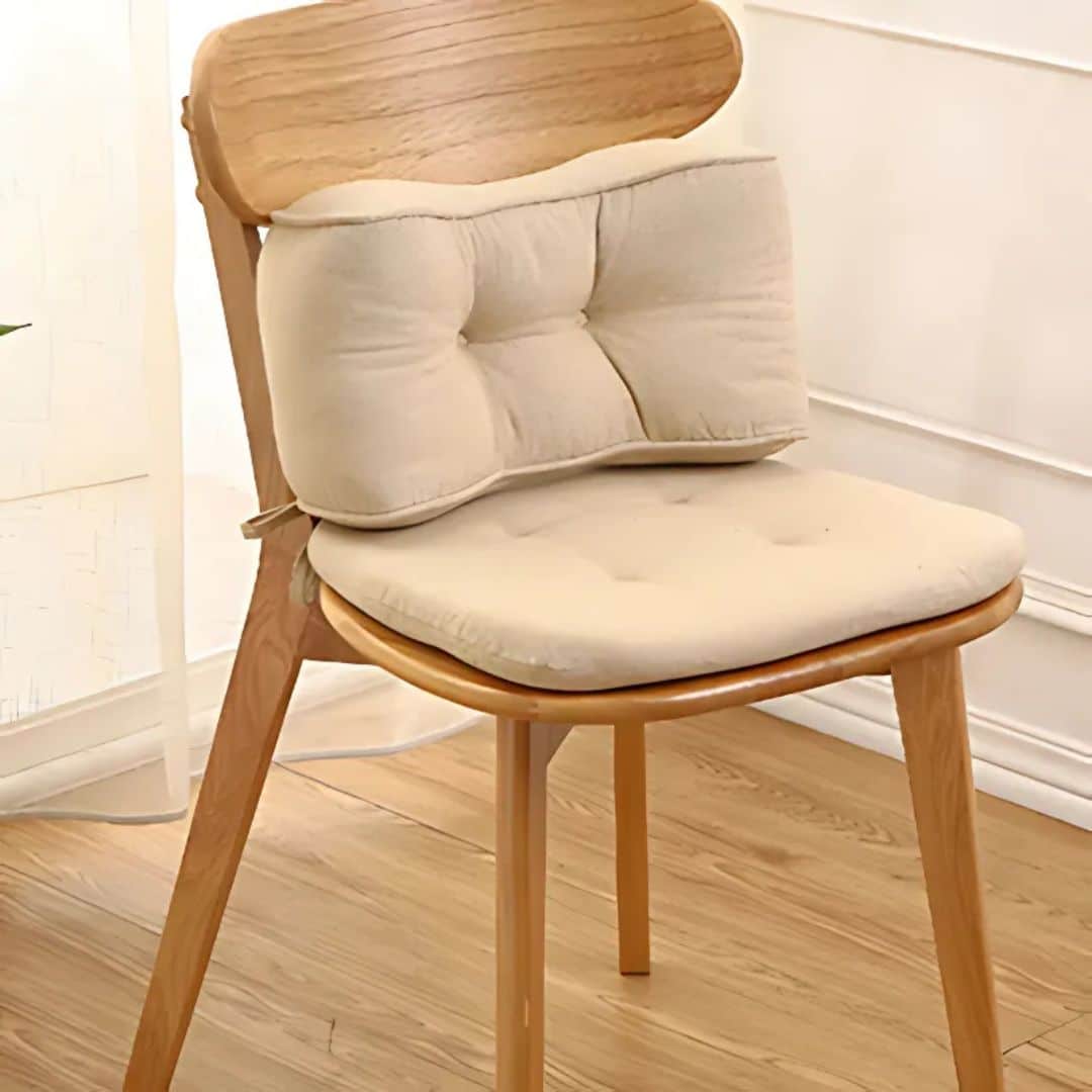 Beige cotton chair cushion for a rounded rattan seat – shown in a room setting