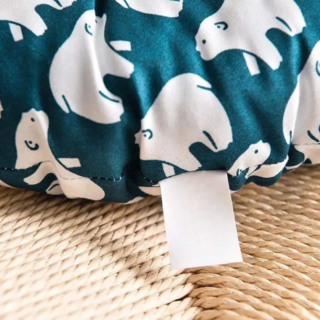 Round chair cushion with polar bear motifs on deep blue – close-up detail
