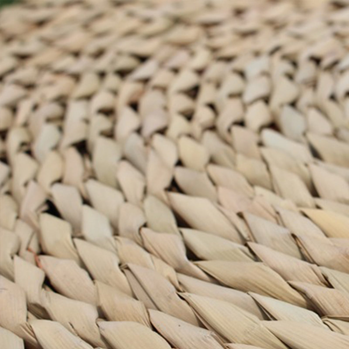 Round cushion with a rattan center and black-and-white fabric border – close-up detail (2)