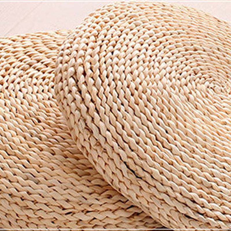 Round light woven rattan cushion – close-up detail