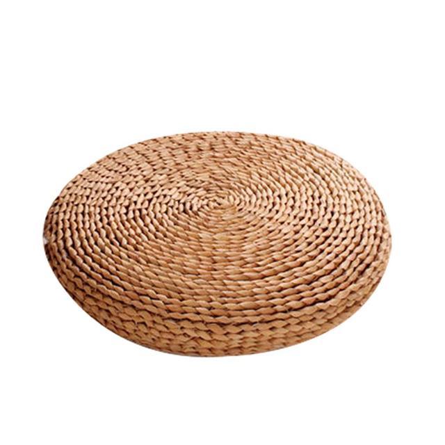 Round dark hand-braided rattan cushion