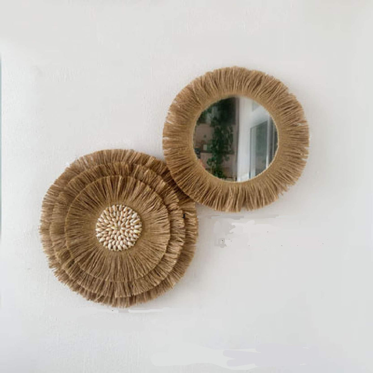 Two round hand-braided rattan wall mirrors in different sizes