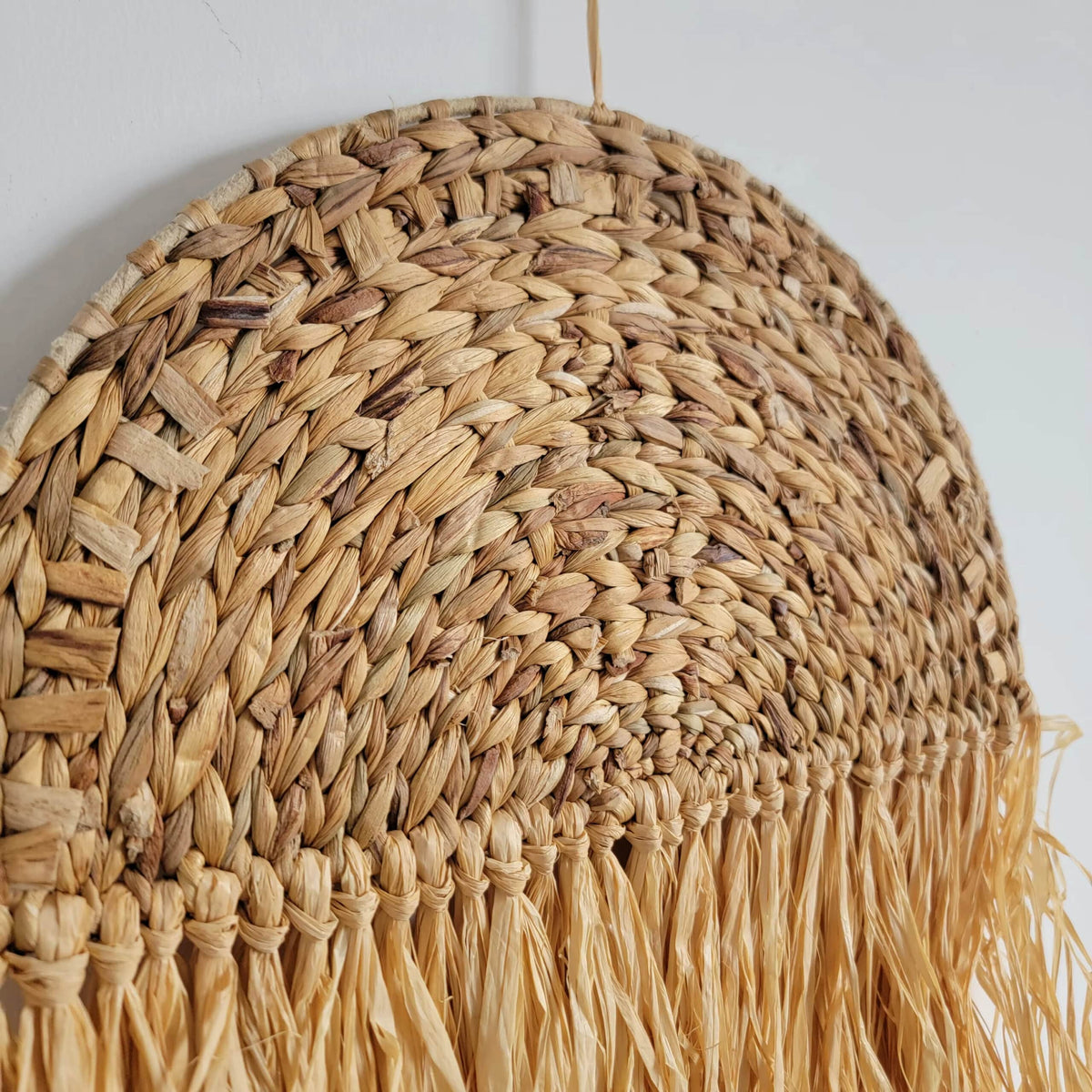 Free-form honey rattan wall art with irregular curves – close-up detail (2)