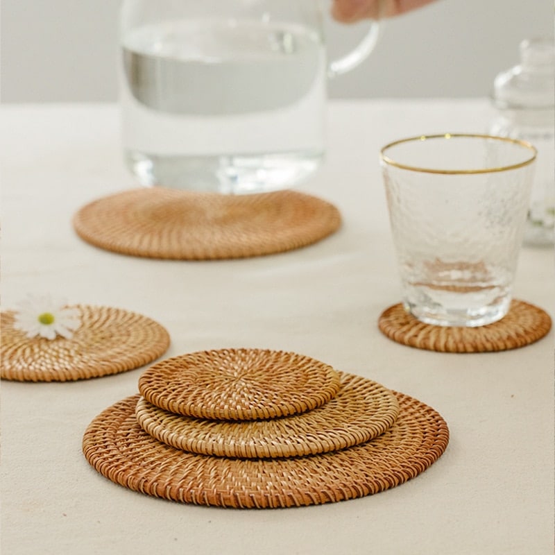 Set of six round rattan coasters with a non-slip base – shown in a room setting (3)