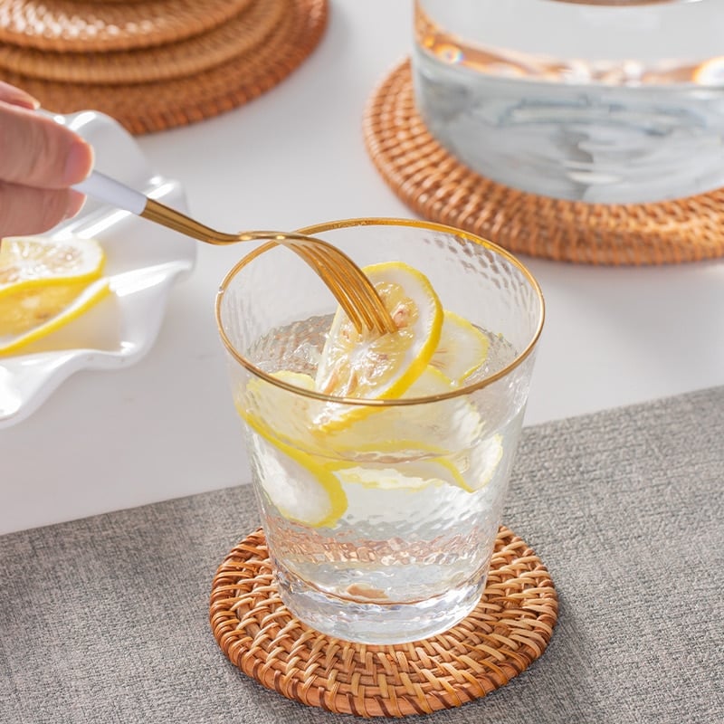 Set of six round rattan coasters with a non-slip base – shown in a room setting (4)