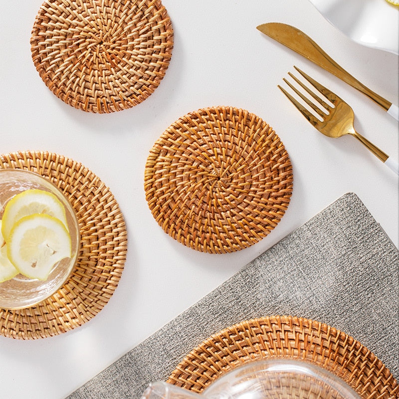 Set of six round rattan coasters with a non-slip base – shown in a room setting