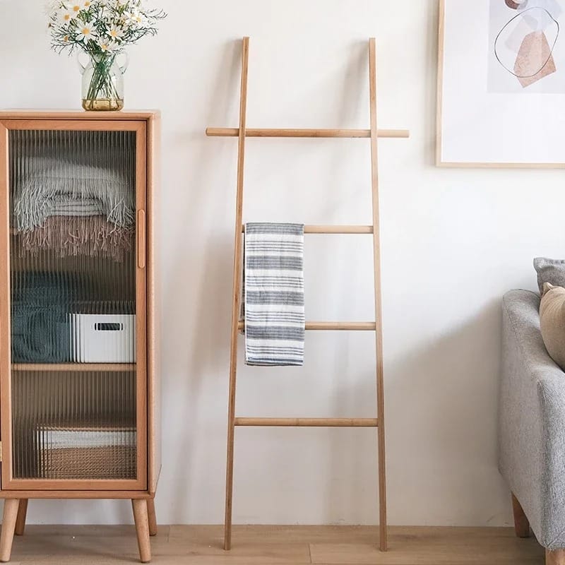 Hand-braided bamboo blanket ladder draped with a throw – shown in a room setting