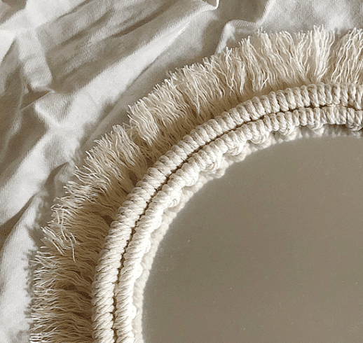 Set of two handwoven golden rattan mirrors – close-up detail