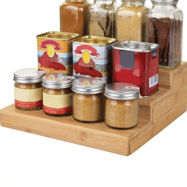 Expandable three-tier bamboo spice rack holding jars and bottles – another view (2)