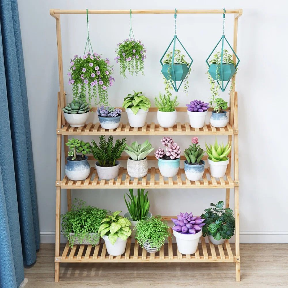 Folding bamboo plant shelf holding flower pots – shown in a room setting