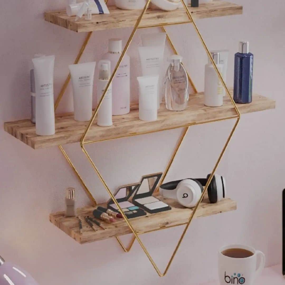 Three-tier light wood wall shelf with a gold metal frame – shown in a room setting (2)