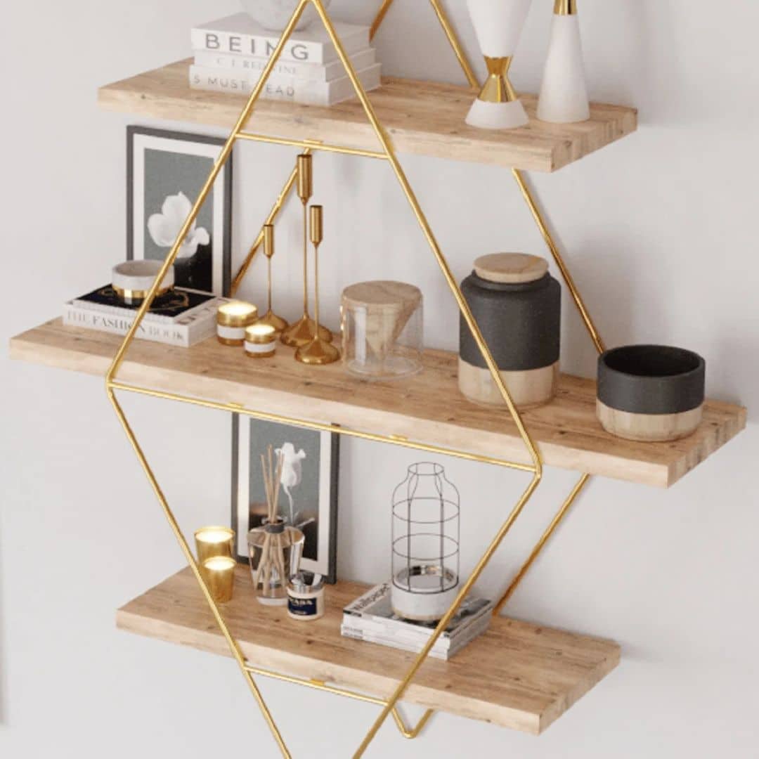 Three-tier light wood wall shelf with a gold metal frame – shown in a room setting