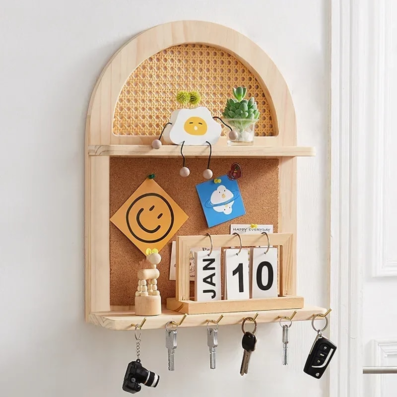 Hand-braided rattan wall shelf with hooks – shown in a room setting (2)
