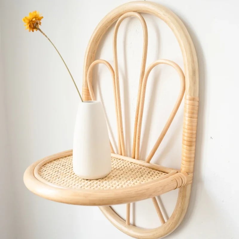 Country rattan wall shelf with softly rounded lines – shown in a room setting