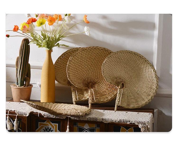 Hand-braided rattan and bamboo hand fans – shown in a room setting