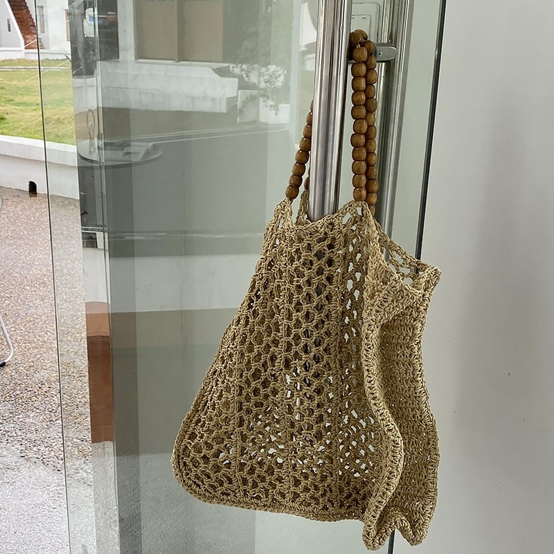 Large handwoven natural straw summer tote – shown in a room setting (3)