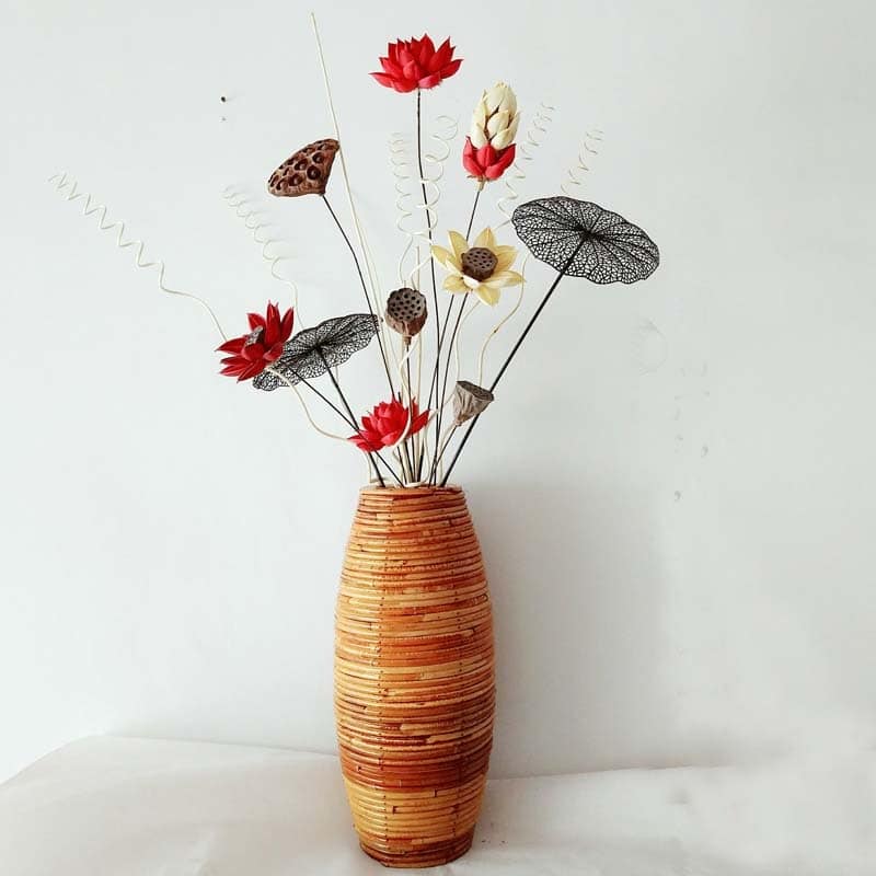 Large dark natural bamboo vase with a generous curve – shown in a room setting