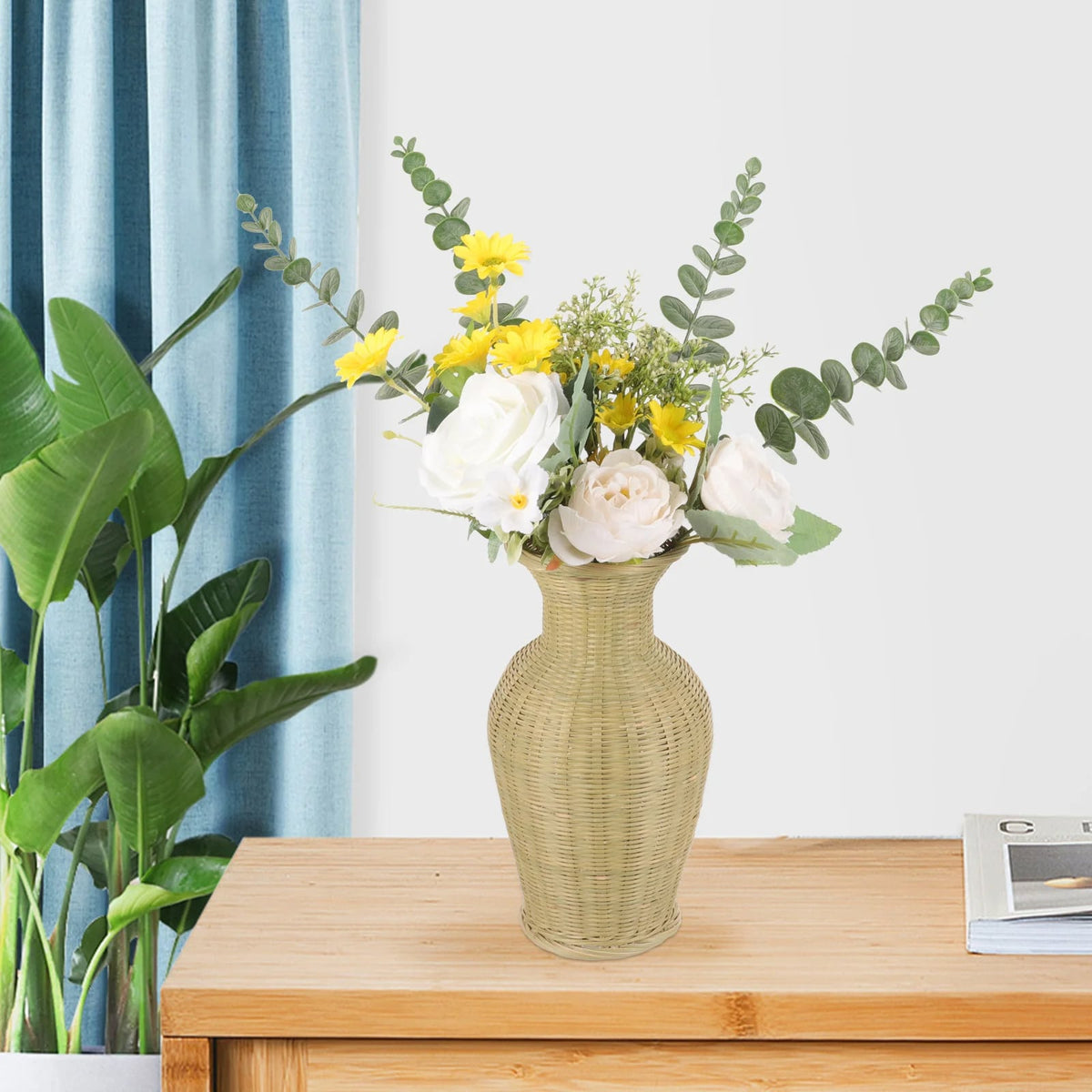 Tall beige wicker-look rattan vase – shown in a room setting